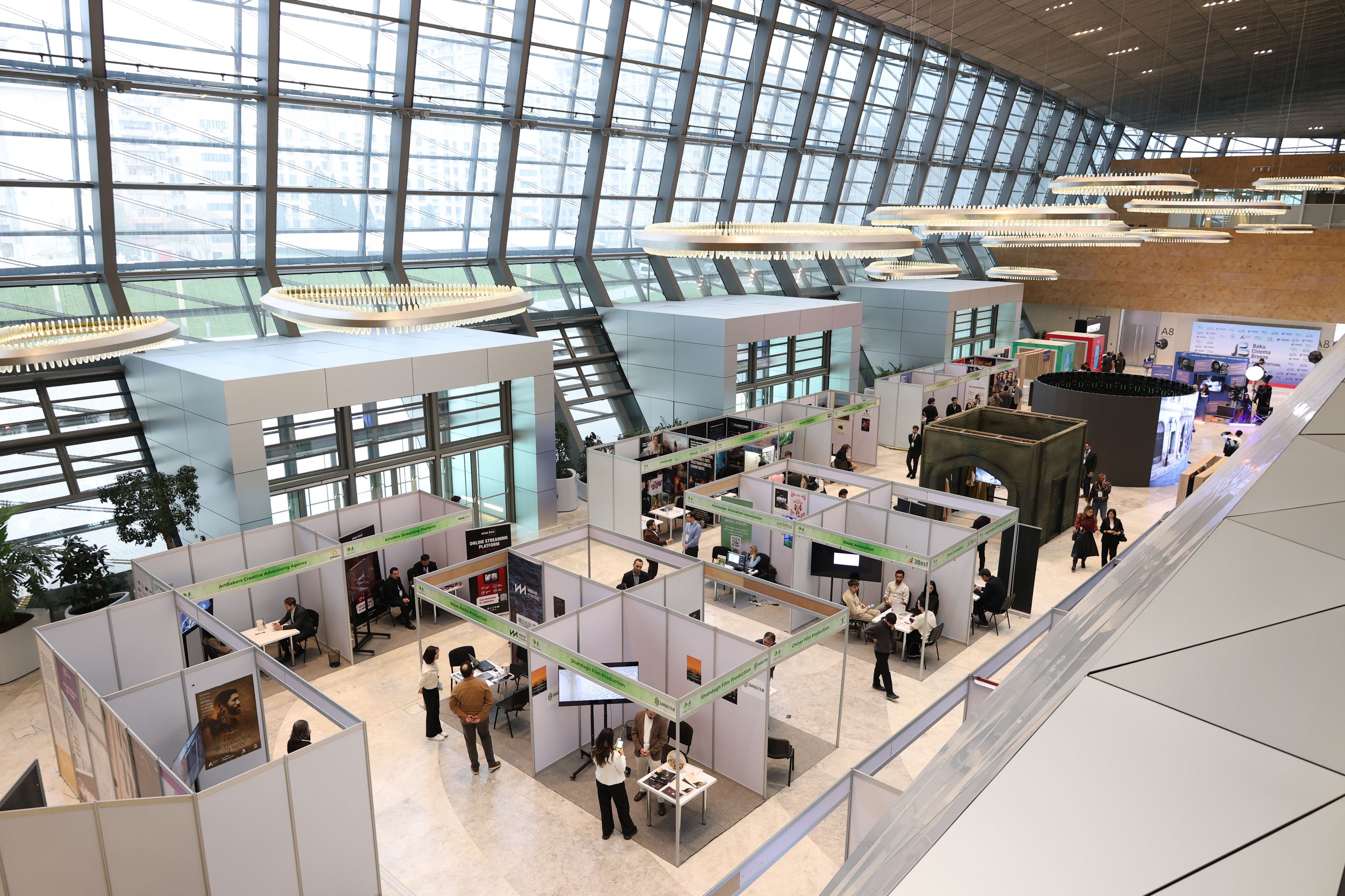 A premium international bar and beverage trade show hall filled with modern exhibition stands and hospitality professionals
